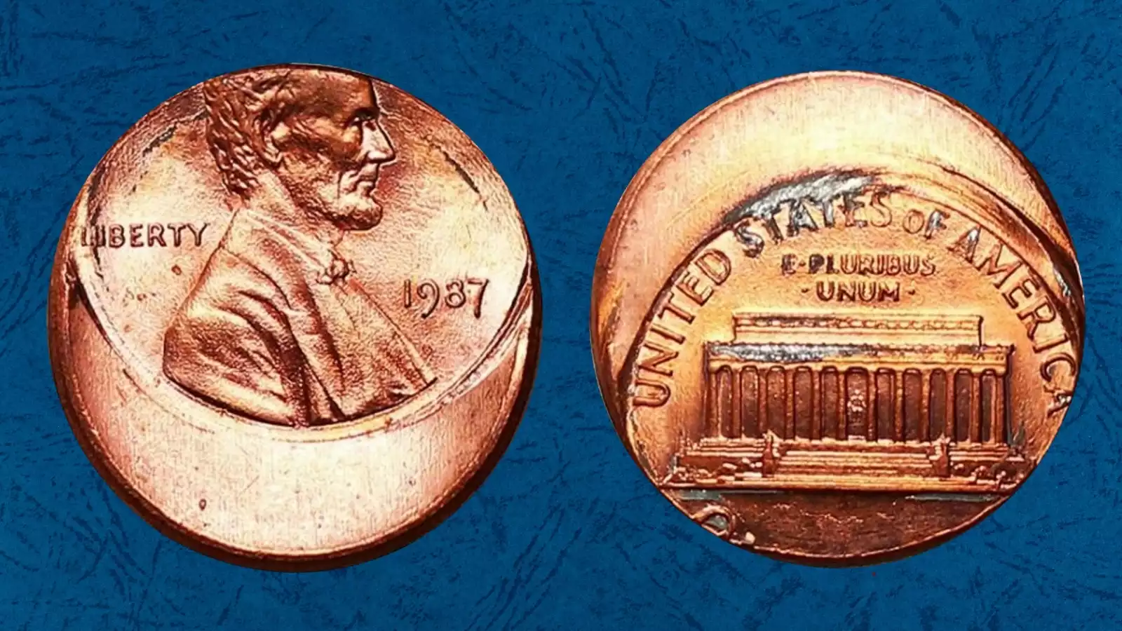 1987 penny off-center strike showing blank planchet crescent with date still visible
